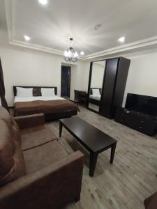 a living room with two beds and a couch at BLH in Yerevan