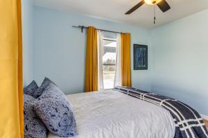 a bedroom with a bed and a window at Inviting Aurora Vacation Rental about 7 Mi to Denver! in Aurora