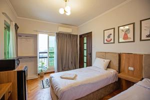 Voodi või voodid majutusasutuse Zamalek X Hostel-Nile view toas