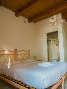 Postel nebo postele na pokoji v ubytování B&B Villa Erika