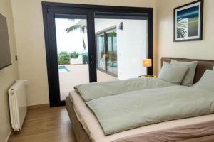 Postel nebo postele na pokoji v ubytování Villa Moritz + 28 fotografií