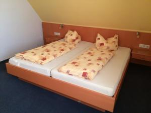 Postel nebo postele na pokoji v ubytování Hotel Am Salzberg