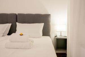 Ένα ή περισσότερα κρεβάτια σε δωμάτιο στο Goldberg Apartments Osijek +11 φωτογραφίες