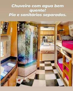 a room with a room with a bed and a bathroom at Experiência num Luxuoso Motorhome in São Roque