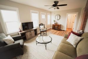 a living room with a couch and a table at The Heritage House in Klamath Falls