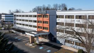 an aerial view of a hotel building with a parking lot at Fairfield Inn & Suites Parsippany in Parsippany
