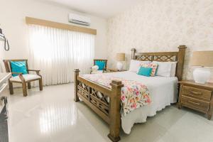 Voodi või voodid majutusasutuse Guacamayos Hotel toas