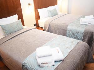 Postel nebo postele na pokoji v ubytování Miculla Hotel + 37 fotografií