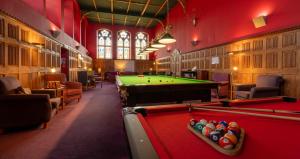 a billiard room with a pool table in a building at Monastery apartment with Loch Ness view in Fort Augustus