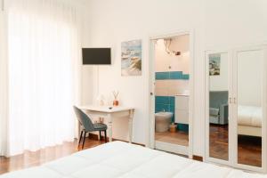 Voodi või voodid majutusasutuse Piazza Tasso Suite toas