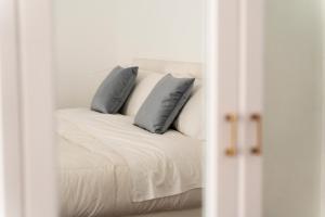 Voodi või voodid majutusasutuse Piazza Tasso Suite toas