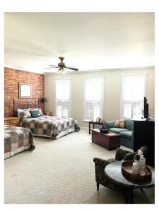 a living room with a bed and a couch at Eagles Nest Inn in Louisiana