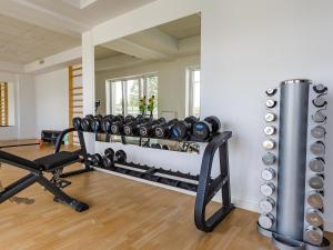a fitness room with a row of exercise equipment at Apartament na Bałtyckiej 6 in Kołobrzeg