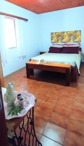 Cama ou camas em um quarto em Casa ampla, 2 qtos, varanda, região de Extrema