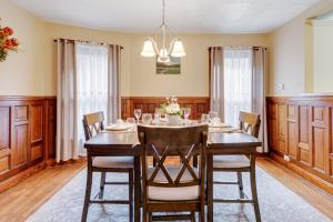 a dining room with a table and chairs at Buffalo Apt with Balcony about 3 Mi to Downtown! in Buffalo