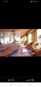 a picture of a room with a colorful carpet at Salah El Din Restaurant on the Nile Corniche in Aswan