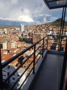 a view of a city from the balcony of a building at penthouse panorámico in Sucre