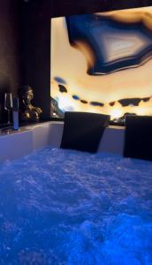 a table with chairs and a cake in a room at SantaTeresa19 Suite & Spa in Palermo