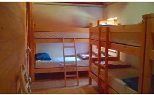 a room with two bunk beds in a room at Rifugio Alpe Bonze in Donnas