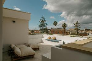 a balcony with a view of a city at La Bella Vita Lecce in Lecce