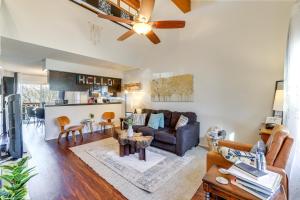 a living room with a couch and a table at Holiday Island Escape with Panoramic Lake Views in Holiday Island