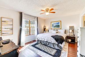 a bedroom with a bed and a ceiling fan at Holiday Island Escape with Panoramic Lake Views in Holiday Island