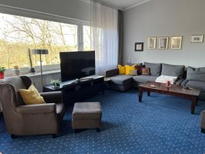 TV a/nebo společenská místnost v ubytování Fi-Ferienhaus