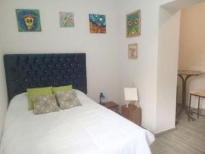 Postel nebo postele na pokoji v ubytování Colores Hospedaje Miraflores