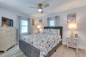 a bedroom with a bed and a ceiling fan at Emerald Coast Getaway Near Boardwalk and Breweries! in Fort Walton Beach