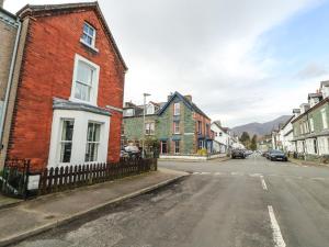 an empty street in a town with buildings at Pelham House in Keswick