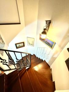 a staircase with a wooden floor and a light at Marmaris'te Özel Havuzlu Doğa Manzaralı Villa in Marmaris +4 photos