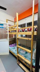 a bunk bed room with two bunk beds at Aashapurti Hotel in Aurangabad