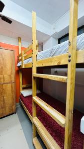 two sets of bunk beds in a room at Aashapurti Hotel in Aurangabad