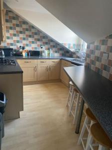 a kitchen with a sink and a counter top at 3 x Double Bedroomed Apartment, Snaith in Snaith
