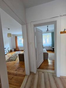 an open door to a room with a living room at Sopot Story in Sopot