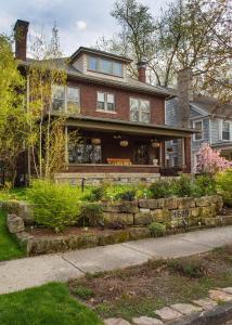 a large brick house with a sidewalk in front of it at Mike & Allen's Place on the Park_2 in Columbus