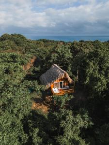 an aerial view of a house in the forest at Villa Maria Tayrona, Jungle and Sea Experience in Los Naranjos