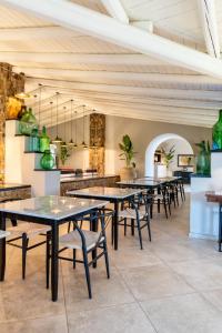 a row of tables and chairs in a restaurant at Villa Felicia in Noto