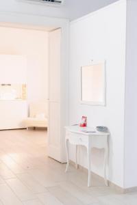 A bed or beds in a room at Gli Appartamenti della Villa