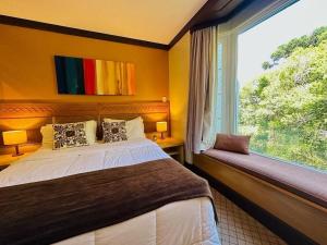 Giường trong phòng chung tại Studio Super Luxo Laje de Pedra MV (3019)