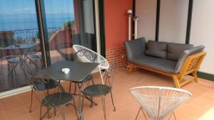 A seating area at Villa Vittorio - Splendid panoramic sea view terrace