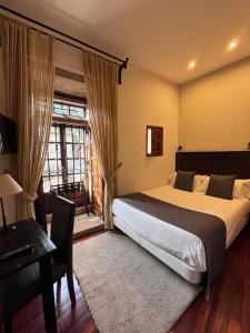 Posteľ alebo postele v izbe v ubytovaní Hotel A Torre do Xudeu