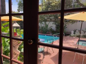 a view of a pool through a window at TIDE POOL VILLAS in Santa Barbara