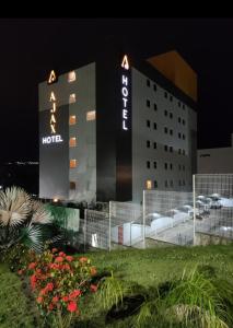 a hotel with a sign on the side of it at Ajax Hoteis in Collatina