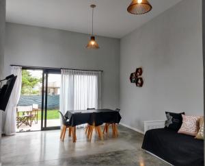 a living room with a table and a couch at Morada del Mar in Mar de Cobo