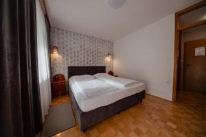 Postel nebo postele na pokoji v ubytování Hotel Maj Inn