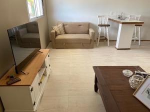 a living room with a couch and a table at La Mia Casa in Florida