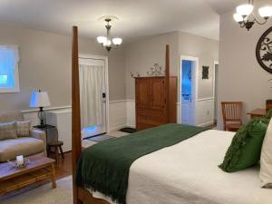 a bedroom with a bed and a living room at Serene Suite by Taconic Ridge, Catamount, Tanglewood, Berkshires in Hillsdale