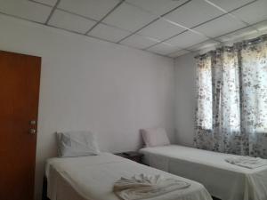En eller flere senger på et rom på Alojamiento David