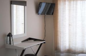 TV a/nebo společenská místnost v ubytování Fevronia's Rooms